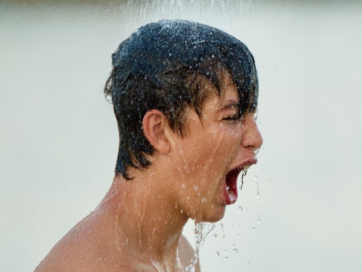 Topless Man With Water Droplets On His Face